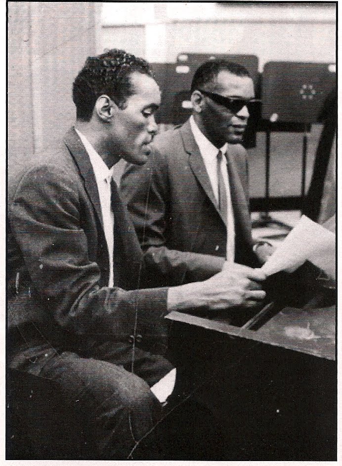 Percy and Ray Chales sit at a piano together