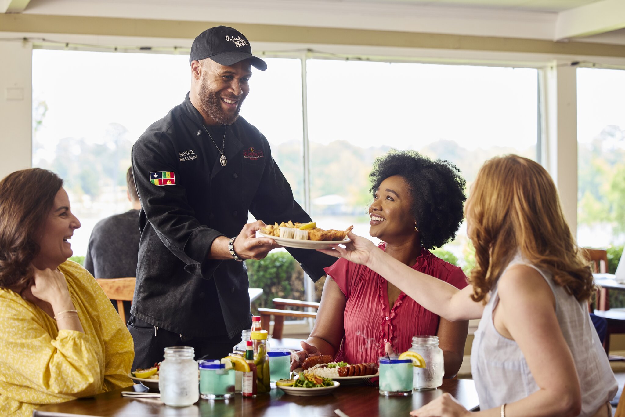 Happy people enjoying food at a Louisiana restaurant