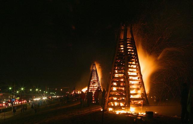 A large wooden structure set on fire during the Louisiana tradition Bonfires on the Levee.