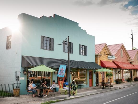 Colorful buildings line a Louisiana main street.
