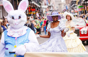 Dancers dressed in extravagant, pastel dressed perform during the French Quarter Easter Parade.